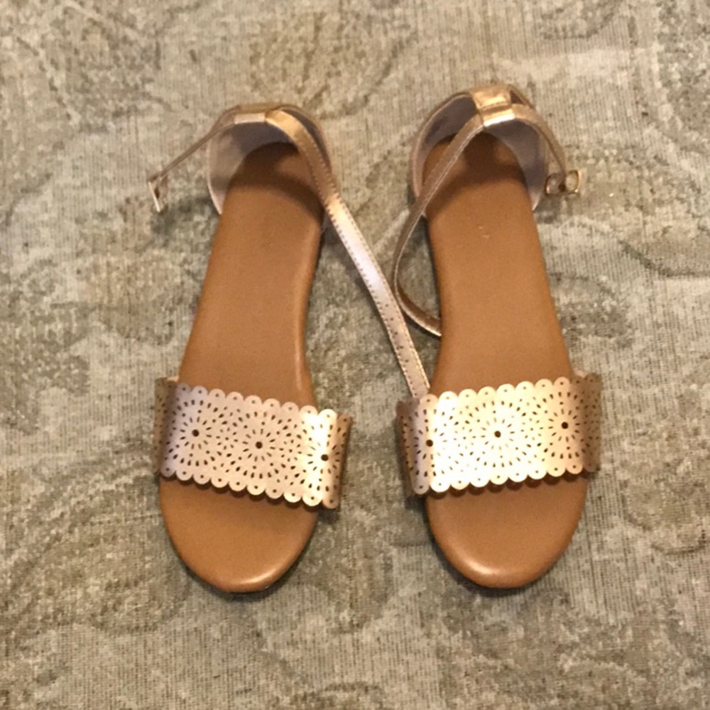 Gold metallic sandals.